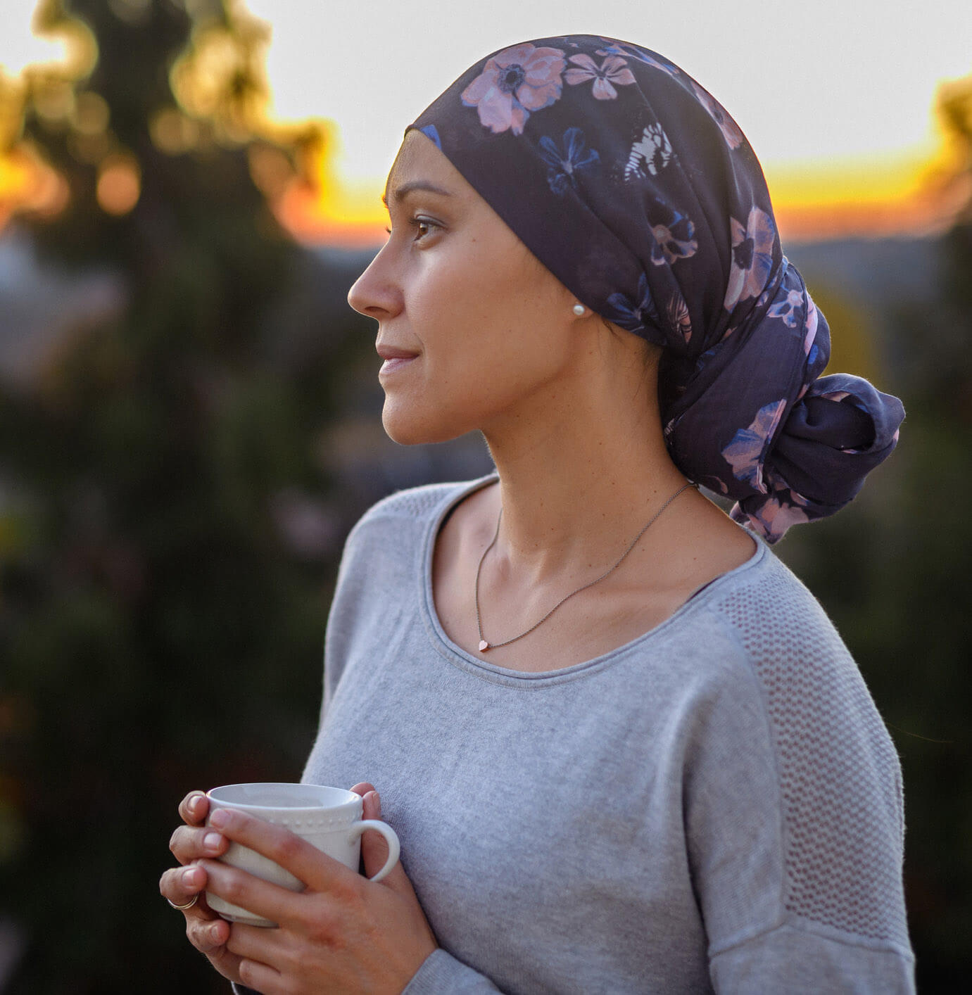 woman holding cup of coffee